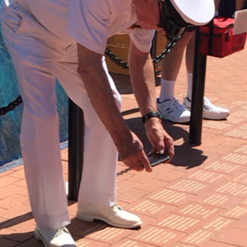 Donor Taking Photo of Engraved Brick