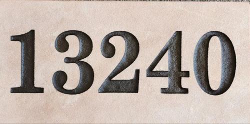 House plaque engraved on tile 